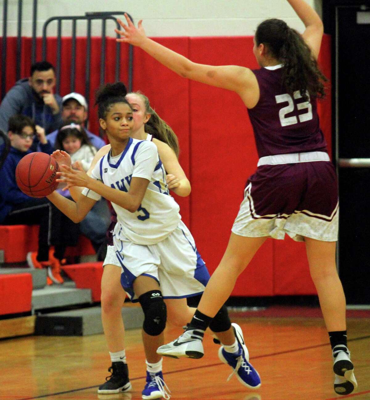 Newtown’s Amy Sapenter looks to pass the ball as Bethel’s Gabriella Mendonca defends in February.