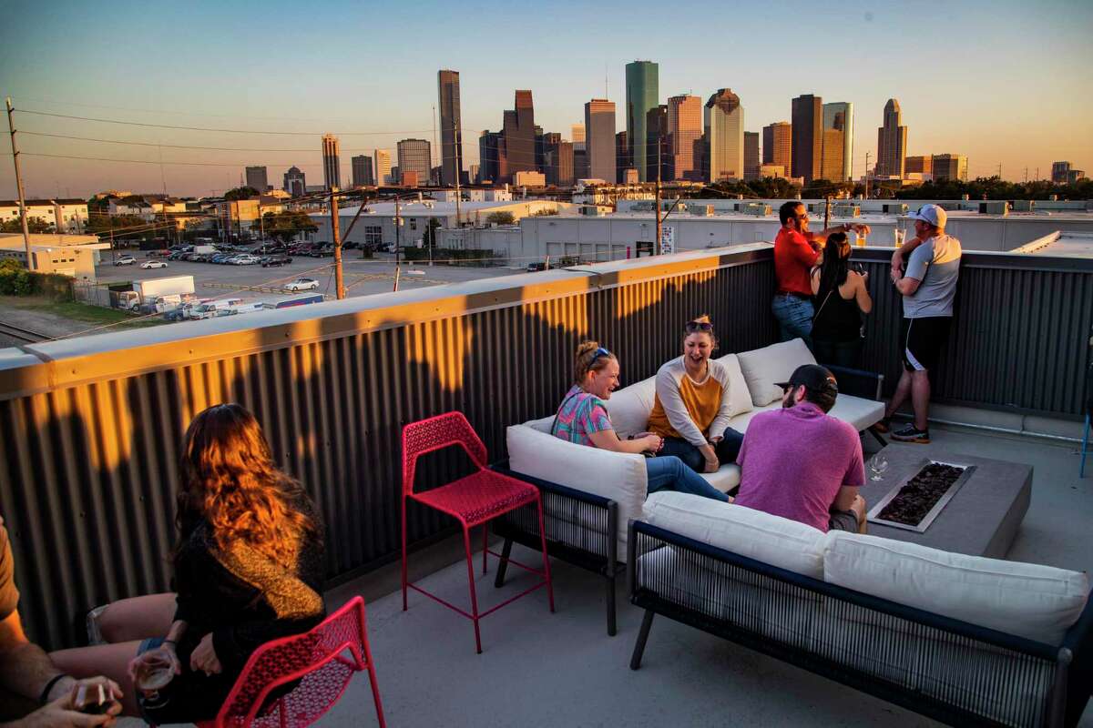 Houstonians enjoy the skyline view from BuffBrew, the new location of Buffalo Bayou Brewing Company. 