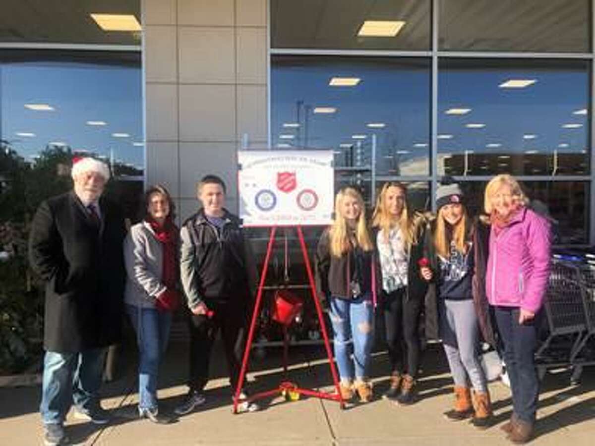 State Reps. Charles Ferraro (R-117) and Kathy Kennedy (R-119) spread some joy in Milford last week ringing the Salvation Army bell and singing some Christmas carols for those in-need with the Key Club students from Foran and Jonathan Law High School.