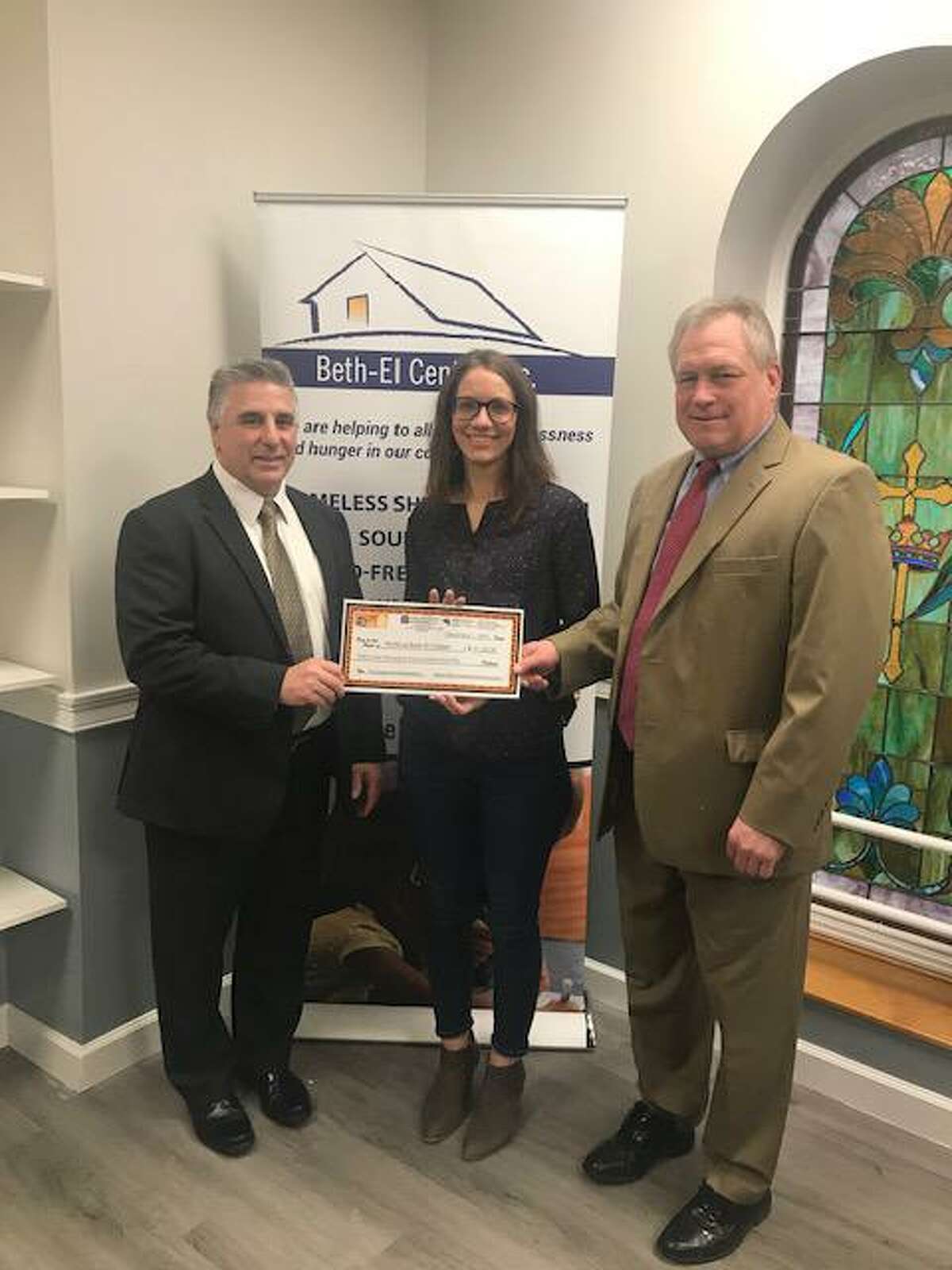 Vincent Ciambriello, president and CEO of Sikorsky Credit Union; Jennifer Paradis, The Beth-El Center's executive director; and Joseph Kubic, attorney at Harlow, Adams & Friedman.