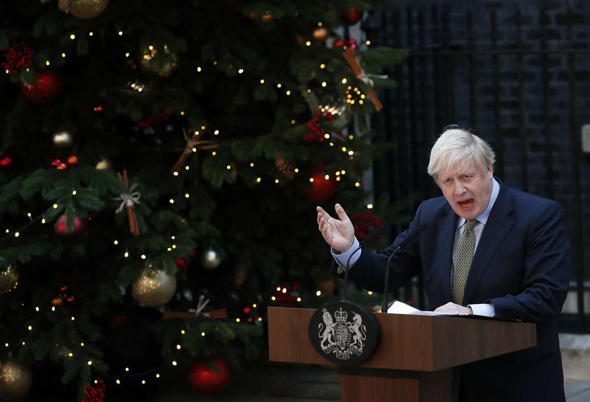 Britain's Prime Minister Boris Johnson addresses the media outside 10 Downing Street in London, Friday, Dec. 13, 2019. Johnson's Conservative Party has won a thumping majority of seats in Britain's Parliament — a decisive outcome to a Brexit-dominated election that should allow Johnson to fulfill his plan to take the U.K. out of the European Union next month.