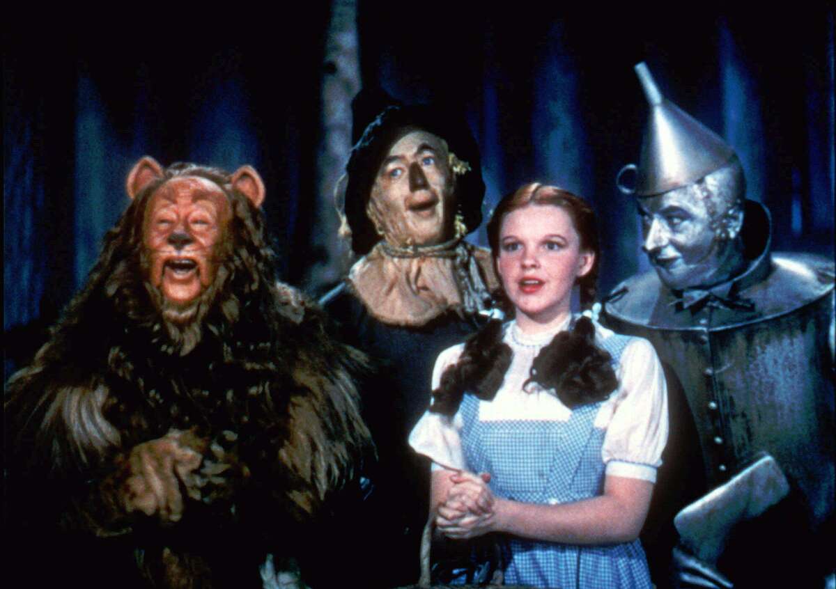 Bert Lahr as the Cowardly Lion, Ray Bolger as the Scarecrow, Judy Garland as Dorothy, and Jack Haley as the Tin Woodman, sing in this scene from "The Wizard of Oz," distributed by Warner Bros. The color lab that restored "Gone With the Wind," last summer has restored "The Wizard of Oz." "It will blow you away," says Tim Reynolds, senior vice president for Technicolor. (AP Photo/HO,Warner Bros)