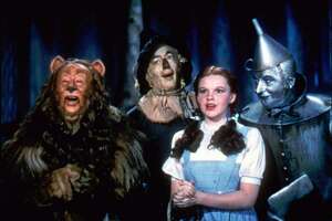 Bert Lahr as the Cowardly Lion, Ray Bolger as the Scarecrow, Judy Garland as Dorothy, and Jack Haley as the Tin Woodman, sing in this scene from "The Wizard of Oz," distributed by Warner Bros. The color lab that restored "Gone With the Wind," last summer has restored "The Wizard of Oz." "It will blow you away," says Tim Reynolds, senior vice president for Technicolor. (AP Photo/HO,Warner Bros)