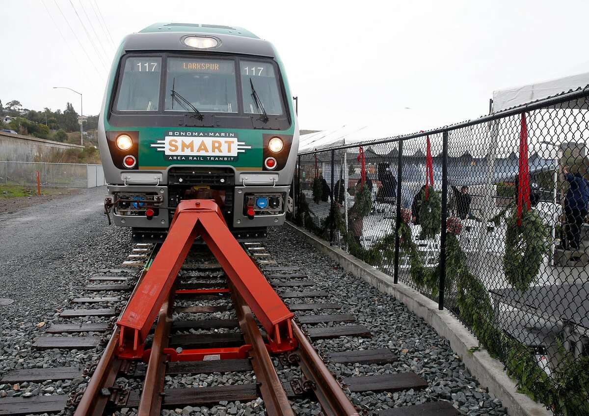 A SMART commuter train is parked at the new station in Larkspur, Calif. on Friday, Dec. 13, 2019. A five minute walk links commuters arriving at the southernmost station in the SMART train system to the Golden Gate Ferry terminal across the street.