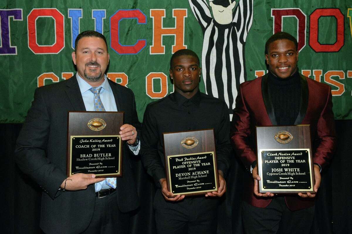 Cy Creek senior Josh White (right) poses with the other Touchdown Club of Houston UIL High School award winners following the organization’s 40th annual dinner, held Dec. 11 at Bayou City Event Center. White was named Defensive Player of the Year, joining, left to right, Alvin Shadow Creek High School Football Coach Brad Butler (Coach of the Year) and Fort Bend Marshall High School Devon Achane (Offensive Player of the Year).