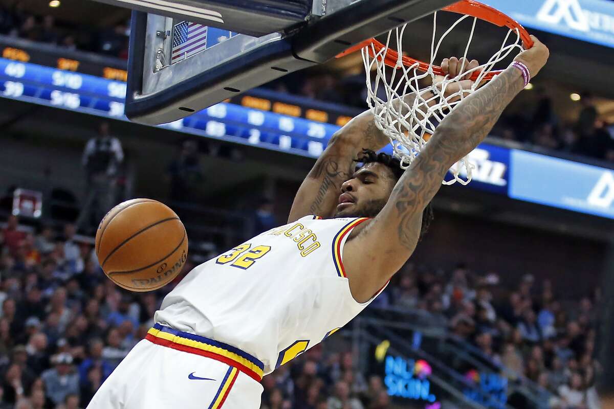 Golden State Warriors forward Marquese Chriss dunks against the Utah Jazz in the first half during an NBA basketball game Friday, Dec. 13, 2019, in Salt Lake City. (AP Photo/Rick Bowmer)