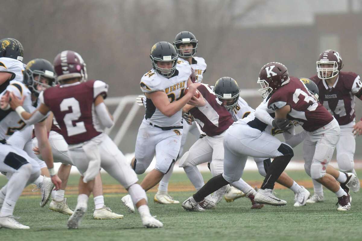 Football action of the CIAC Class M Football Championship between the Weston Trojans and Killingly played on Saturday Dec 14 ,2019 at Veterans Stadium in New Britain, Connecticut.