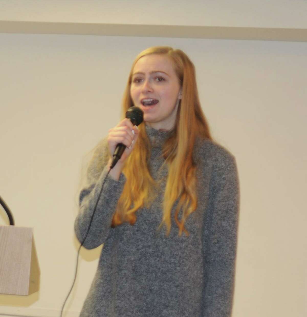 Madelyn Aug, who lives in Sandy Hook and goes to WestConn, sang 'Rise Up' at Ridgefield's Sandy Hook remembrance observances on Saturday, Dec. 14, the seventh anniversary of 2012 shooting at Sandy Hook Elementary School in Newtown.