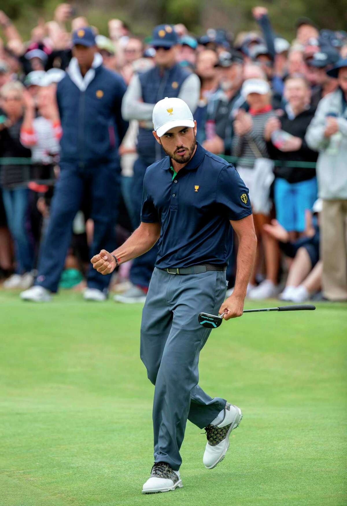 International team member Abraham Ancer of Mexico celebrates sinking a putt to win his match during the Presidents Cup golf tournament in Melbourne on December 14, 2019. (Photo by SIMON BAKER / AFP) / -- IMAGE RESTRICTED TO EDITORIAL USE - STRICTLY NO COMMERCIAL USE -- (Photo by SIMON BAKER/AFP via Getty Images)
