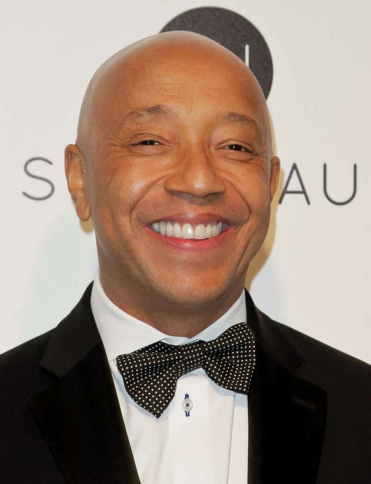 US entrepreneur and producer Russell Simmons poses upon his arrival for the 25th annual Elton John AIDS Foundation's Academy Awards Viewing Party on February 26, 2017 in West Hollywood, California. / AFP PHOTO / TIBRINA HOBSONTIBRINA HOBSON/AFP/Getty Images ORG XMIT: 1