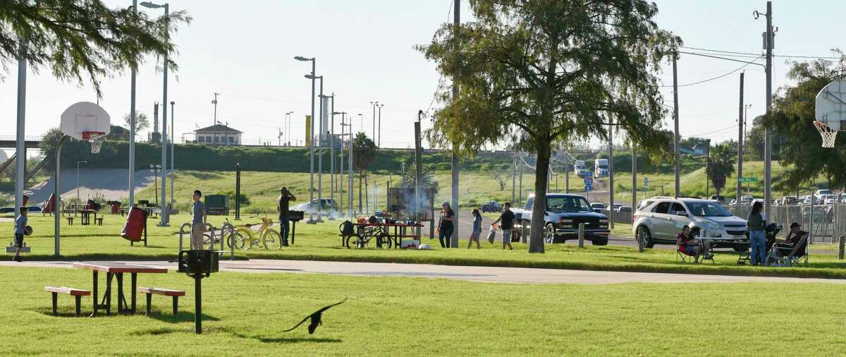A family has a quiet cookout at Tres Laredos Park, just several yards away from the Rio Grande, on Nov. 3, 2018. The federal government is offering to compromise with Laredo City Council to build a more aesthetically appealing version of the wall in this area in exchange for their cooperation going forward.