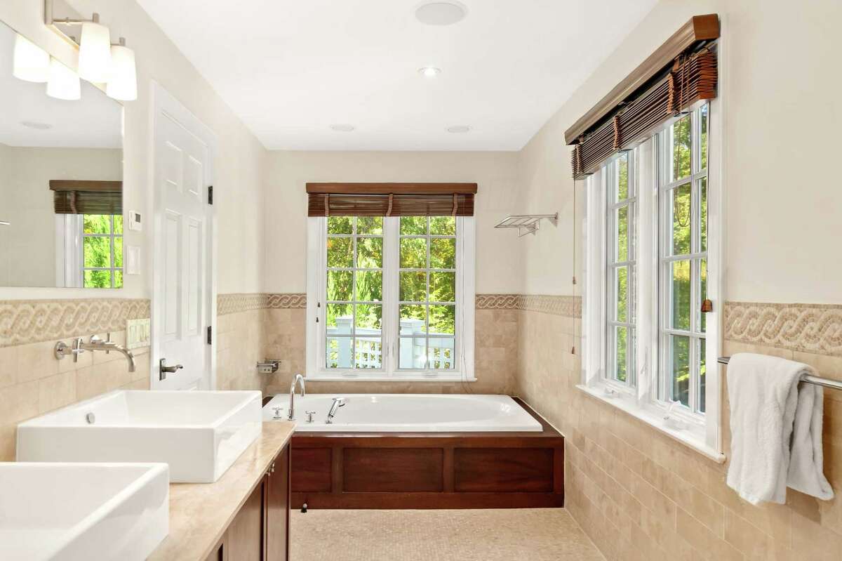 Cos Cob shinglestyle colonial has gardens