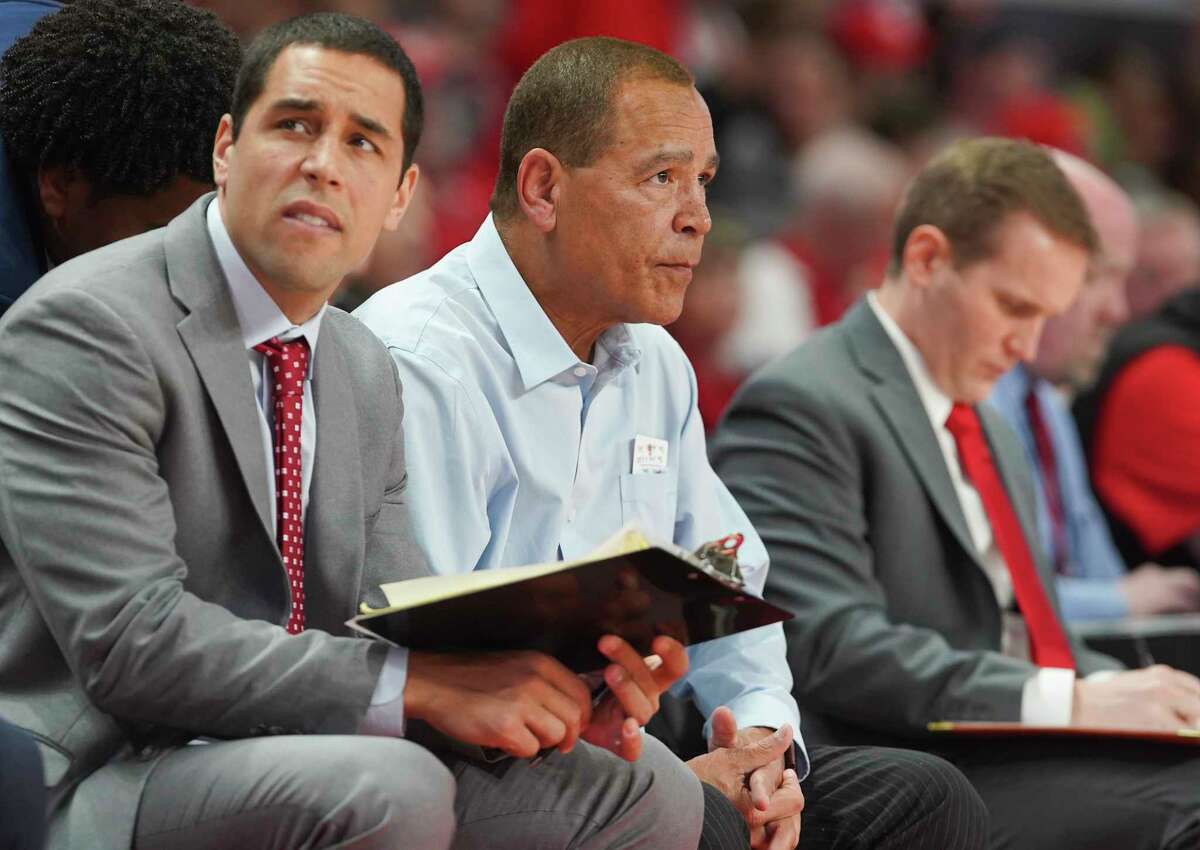 Houston Cougars assistant coach Kellen Sampson and head coach Kelvin Sampson sit on the sidelines during the second half against Oklahoma State Cowboys at the Fertitta Center on Sunday, Dec. 15, 2019 in Houston. Houston Cougars lost the game 61-55.