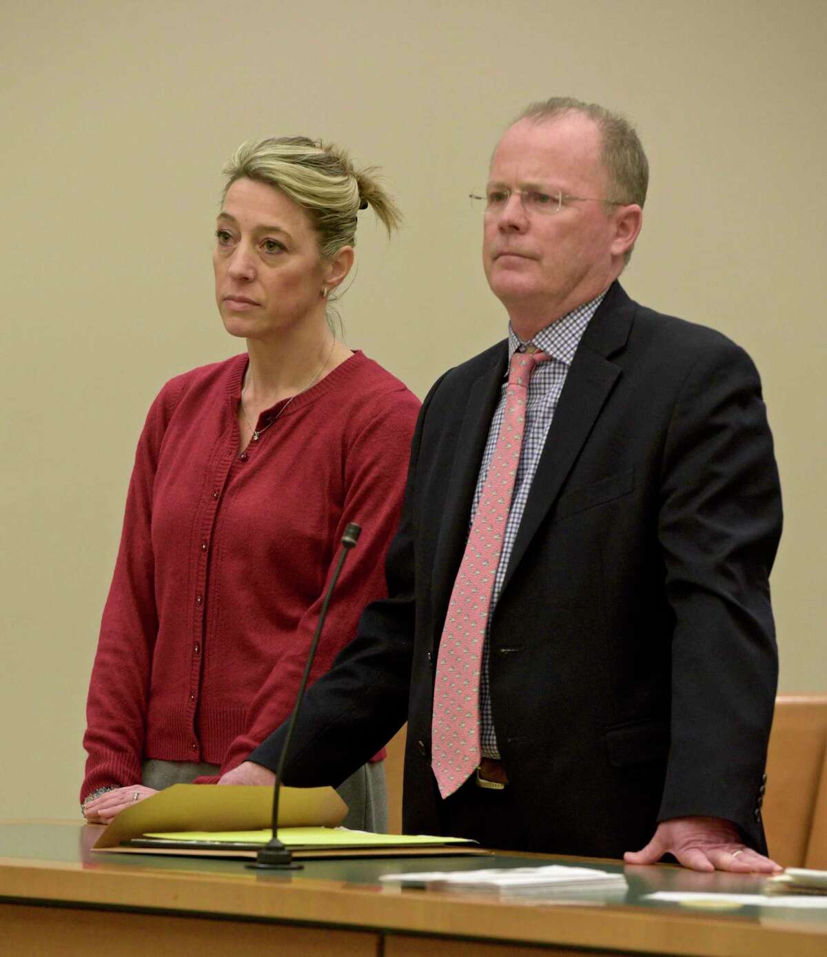 Kris Szabo, left, of Southbury, appears in Waterbury Superior Court with attorney John McDonald, on Wednesday, December 11, 2019, in Waterbury, Conn.