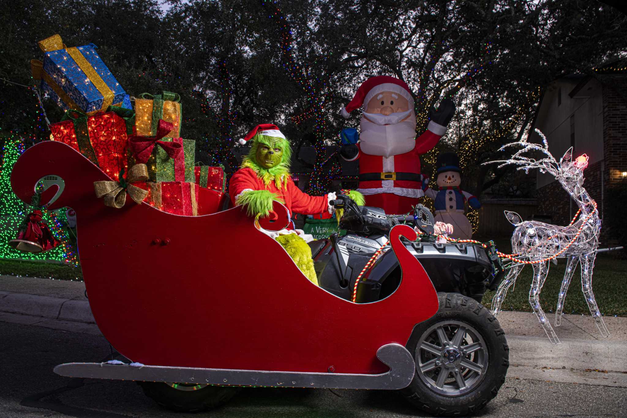 San Antonio man steals the Christmas show as the Grinch on an ATV sled