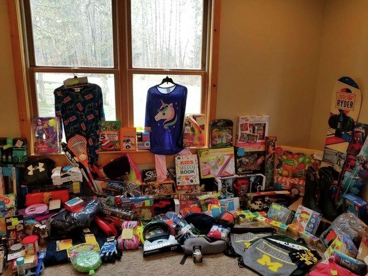 According to event organizer Heidie Decker Thomas, "Christmas Miracles" received more than 200 presents this year. Thomas said the presents will be helping eight families in need this holiday season, and each child will receive eight to 10 gifts. (Courtesy photo)