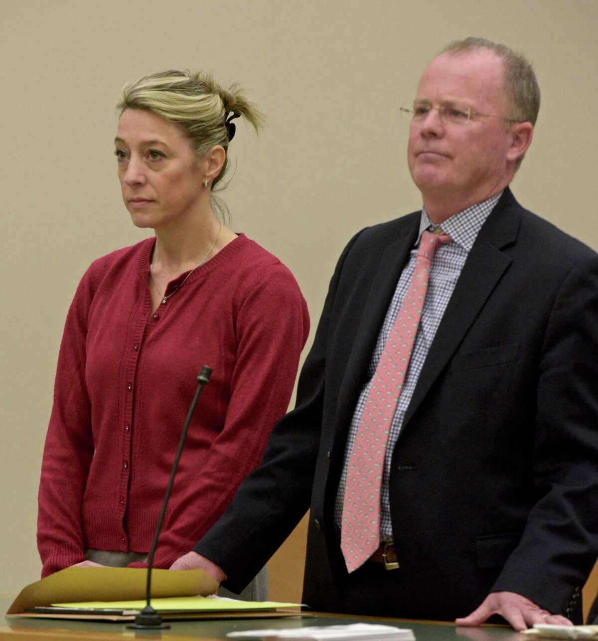 Kris Szabo, left, of Southbury, appears in Waterbury Superior Court with attorney John McDonald, on Wednesday, Dec.11, 2019, in Waterbury, Conn.