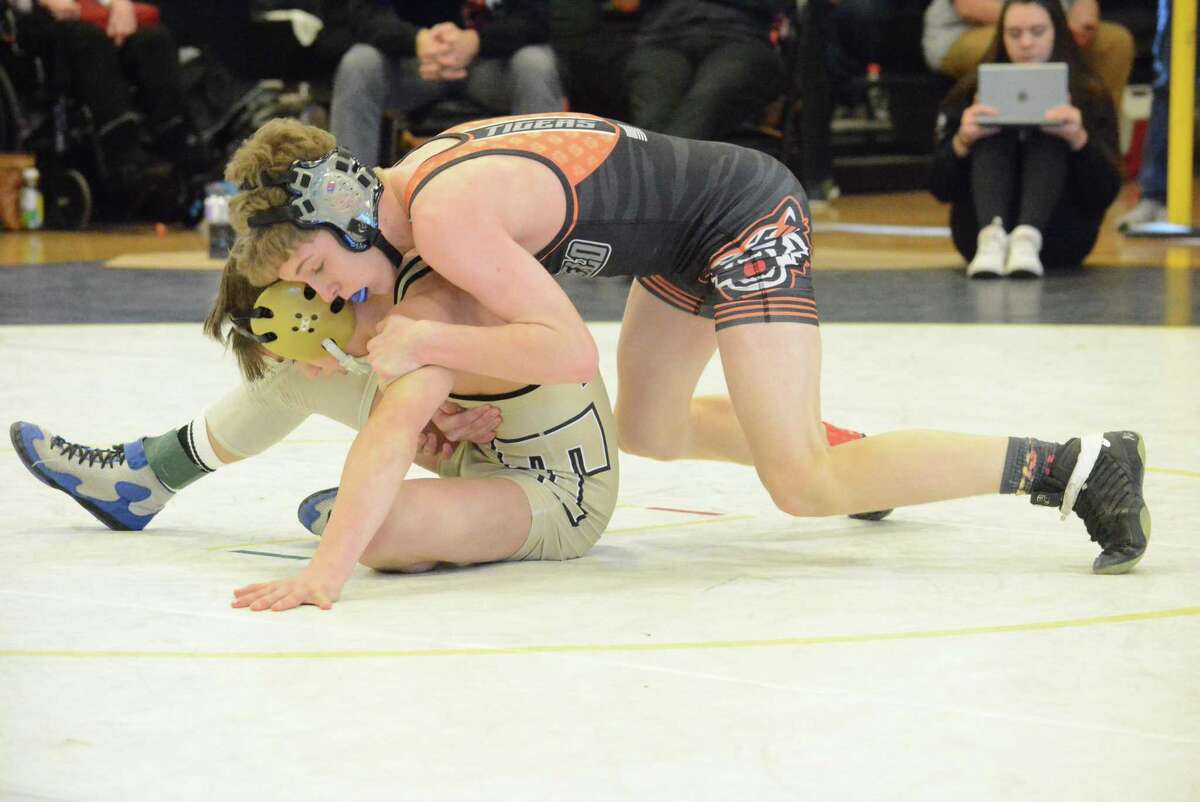 Ridgefield's Nate Blaha controls an opponent during a match last season.