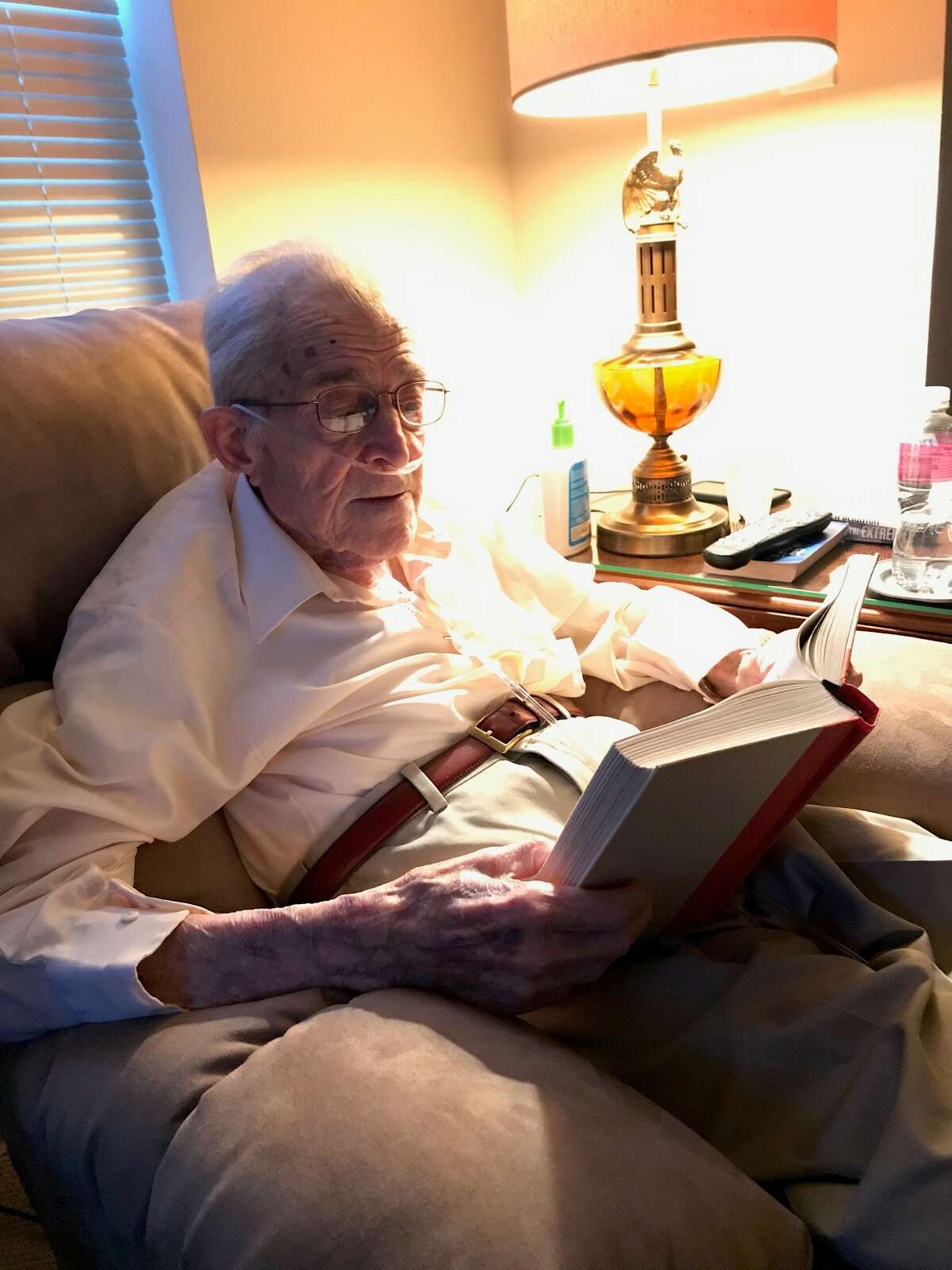 Don Black, a World War II vet, reads in his new electric recliner at Brookdale, an assisted-living facility in Niskayuna, six months after a terrifying fall and broken hip and cancer diagnosis.