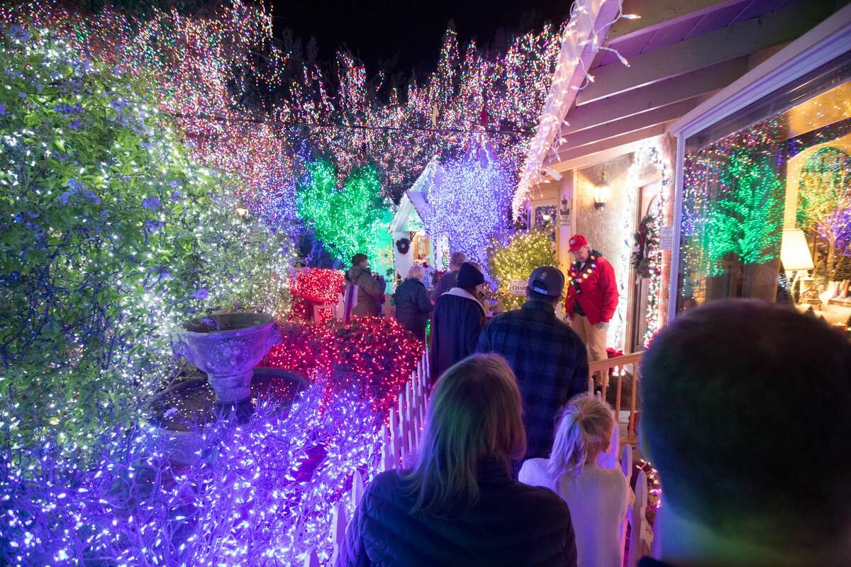 Visitors walk through the Deacon Dave light display in 2019. After going on hiatus last year due to the COVID-19 pandemic, the popular Livermore display — and its 640,000 lights — is back.