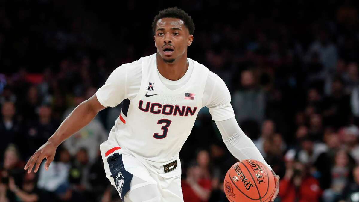 Connecticut guard Alterique Gilbert (3) drives toward the basket during the first half of an NCAA college basketball game against Indiana in the Jimmy V Classic, Tuesday, Dec. 10, 2019, in New York. (AP Photo/Kathy Willens)
