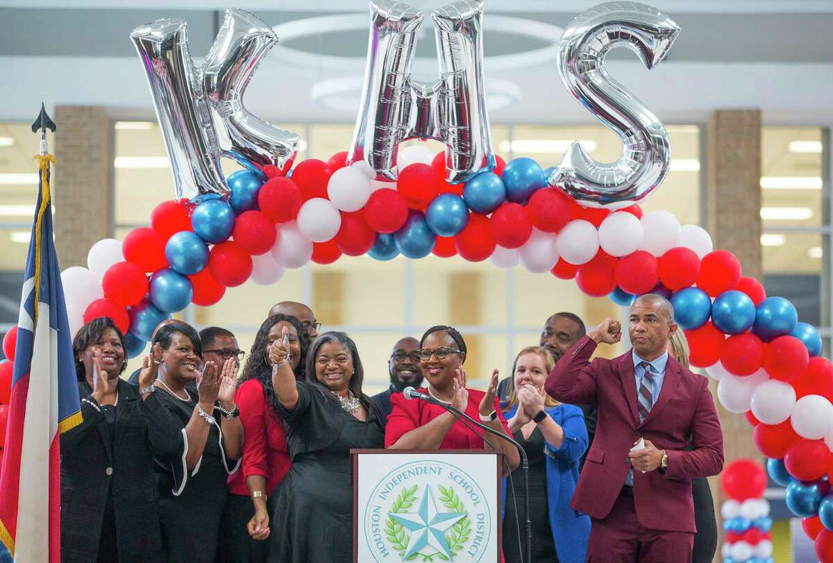 Houston Independent School District Interim Superintendent Dr. Grenita Lathan (center) cheers with Kashmere High School principal Reginald Bush (right) and his staff at the school during a celebration marking the school's meeting of state expectations for the first time in 11 years at the school in Houston, Thursday, Aug. 15, 2019. Thursday the TEA released the state's latest school accountability ratings.
