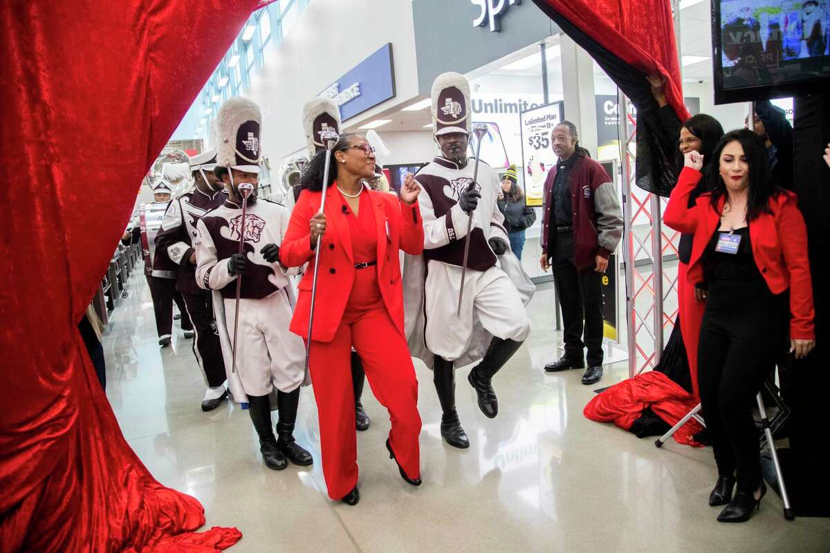 Anika Wiley who is part of H-E-B leadership, enters the opening event for the new store H-E-B MacGregor Market on Tuesday, Dec. 17, 2019, in Houston leading the Texas Southern University’s marching band Ocean of Soul.
