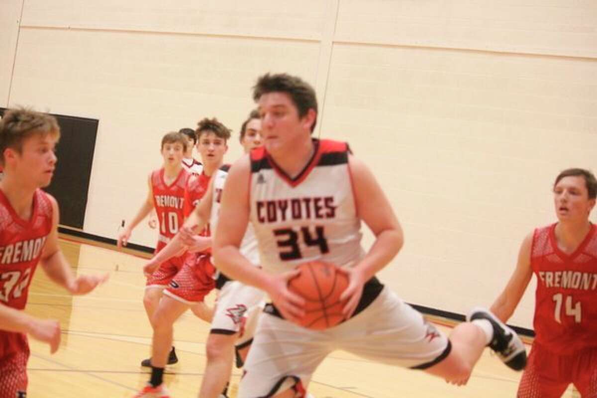 Canyon Reed (34) goes to the basket for Reed City against Fremont. (Herald Review photo/John Raffel)