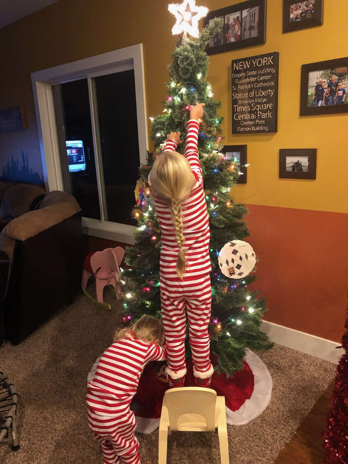 "Araya and Anisa Braginton love to decorate their Christmas Tree!" Araya and Anisa Braginton