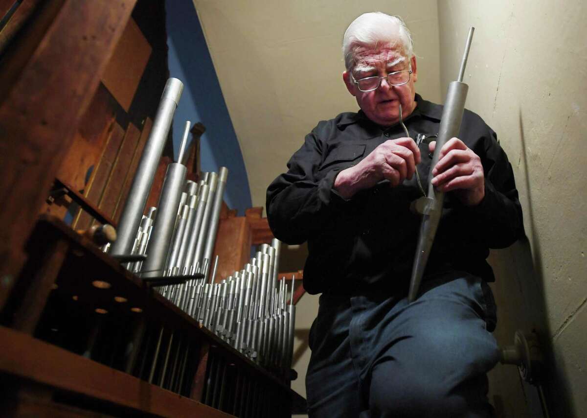 Richard Hamar, of Norwich, reconstructs and tunes the 1849 vintage pipe organ at Christ Episcopal Church Tashua in Trumbull, Conn. on Tuesday, December 17, 2018. The organ, damaged by a summer ceiling collapse, is on schedule to be back in operation for Christmas eve services.