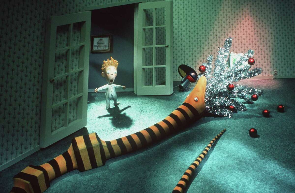 A young boy is astonished to see one of Santa’s gifts, an over-sized snake, devour the family Christmas tree in Touchstone Pictures animated film “Tim Burton’s A Nightmare Before Christmas,” which will be screened at Cos Cob Library Dec. 23.