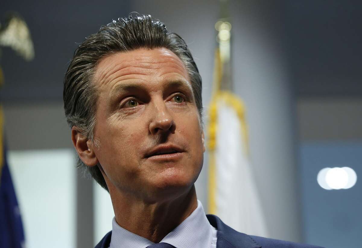FILE - In this April 12, 2019, file photo, California Gov. Gavin Newsom answers a reporter's question about a report he presented concerning the worsening wildfires in the state, during a news conference, in Rancho Cordova, Calif. Newsom has rejected a $13.5 billion settlement that Pacific Gas & Electric struck just last week with thousands of people who lost homes, businesses and family members in a series of devastating fires that drove the nation's largest utility into bankruptcy. (AP Photo/Rich Pedroncelli, File)