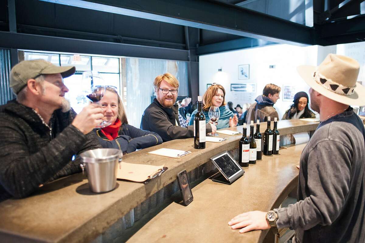 Winemaker Bret Urnes talks with customers at Levo Wine tasting room in Paso Robles, Calif.