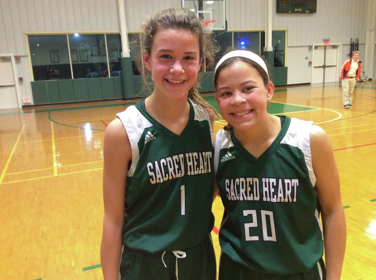 Eighth-graders Payton Sfreddo, left and Madison Hart, helped lead the Sacred Heart Greenwich basketball team to a 66-31 win vs. Greenwich Academy on Wednesday, December 18, 2019.s