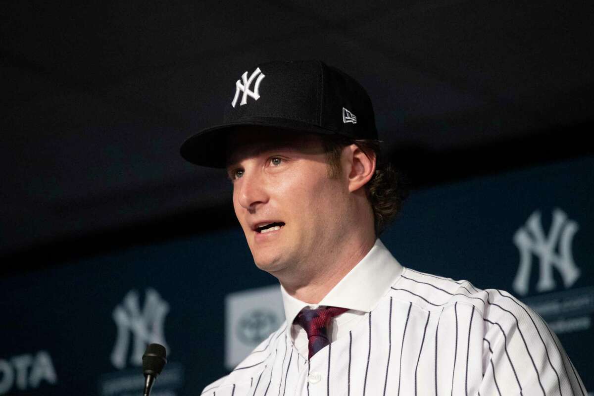 Gerrit Cole is introduced as the newest New York Yankees player during a baseball media availability, Wednesday, Dec. 18, 2019 in New York. The pitcher agreed to a 9-year $324 million contract. (AP Photo/Mark Lennihan)