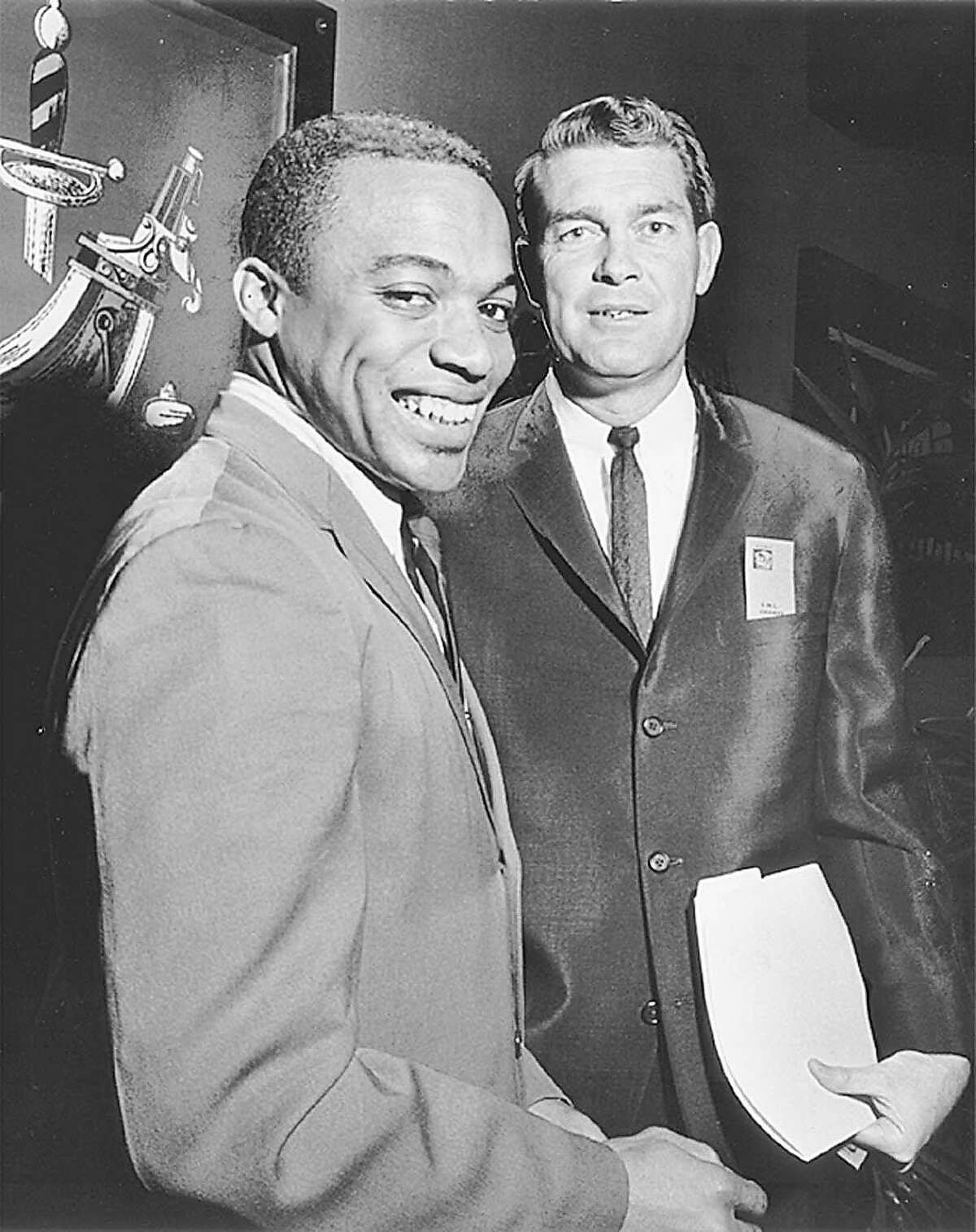 ** ADVANCE FOR WEEKEND, AUG. 7 - 8 -- FILE ** Jerry LeVias, left, poses with Southern Methodist University coach Hayden Fry after being named Southwest Conference Player of the Year in 1968. LeVias and Fry are scheduled to be inducted this month into the College Football Hall of Fame. (AP Photo/Dallas Morning News, File)