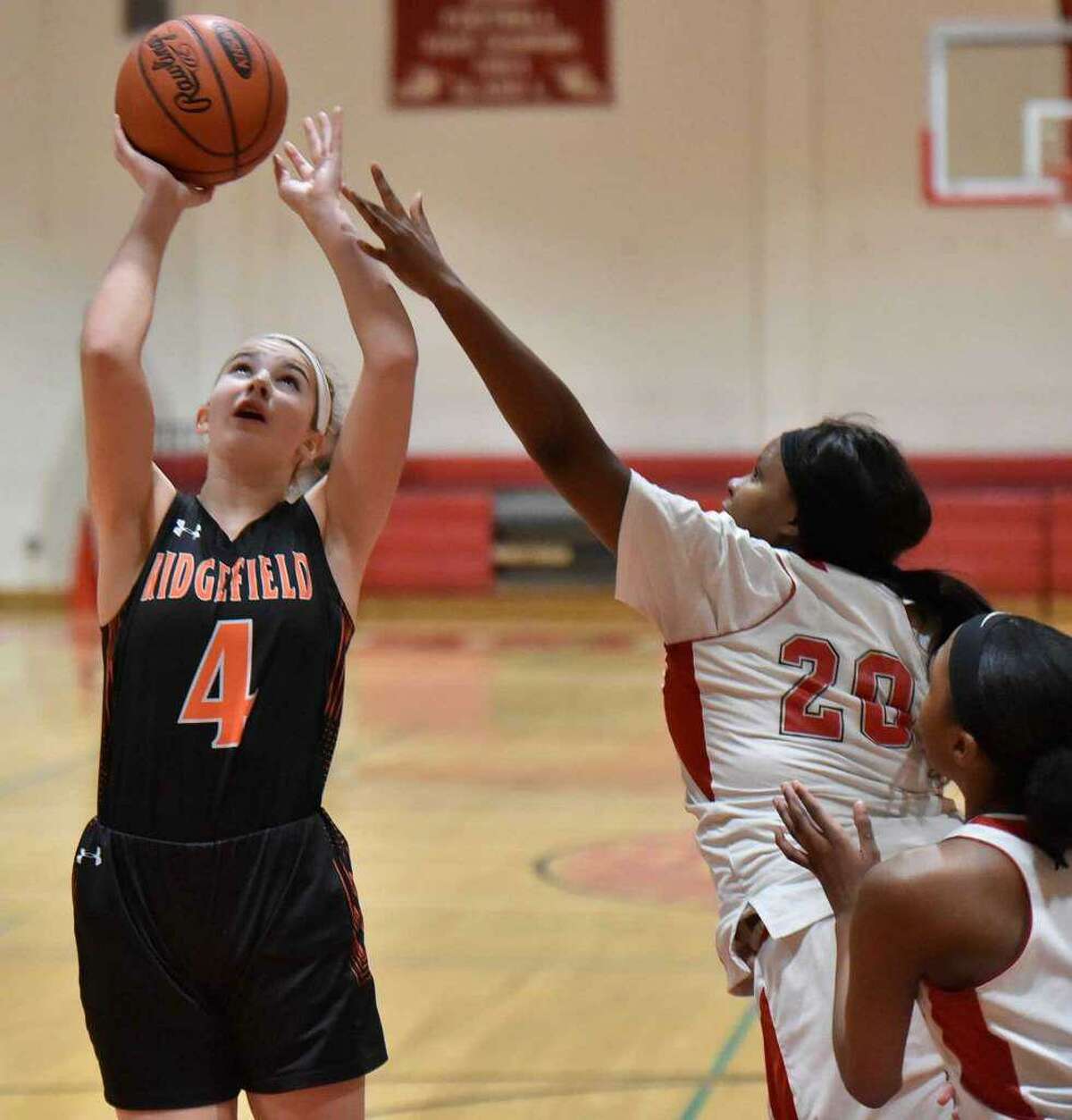 Katie Flynn (shown in a game last season) scored 19 points to help Ridgefield beat Lauralton Hall on Wednesday night in Milford.