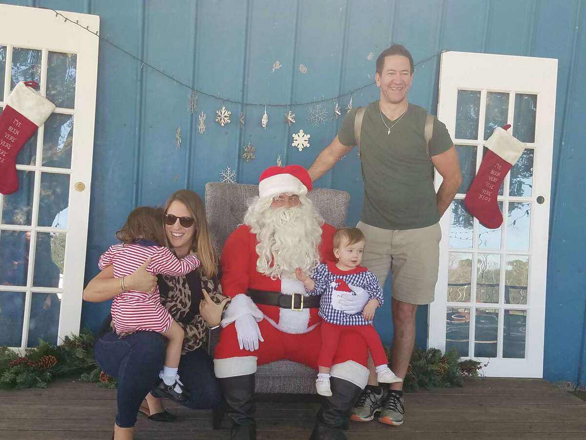 From left, Grace, Liz, Anna and Anthony Broussard meet Santa at Christmas in Katy.