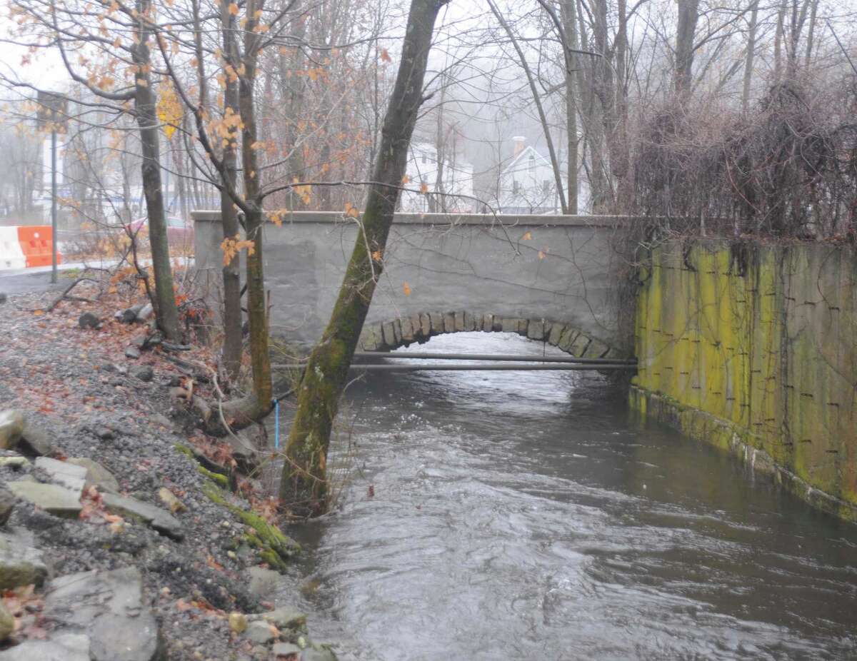 Depot Road Bridge will cost an estimated $2.3 million to repair, with the town's share $354,000. Water was high during the rains Dec. 14, 2019. An orange barrier closing the bridge is at far right.