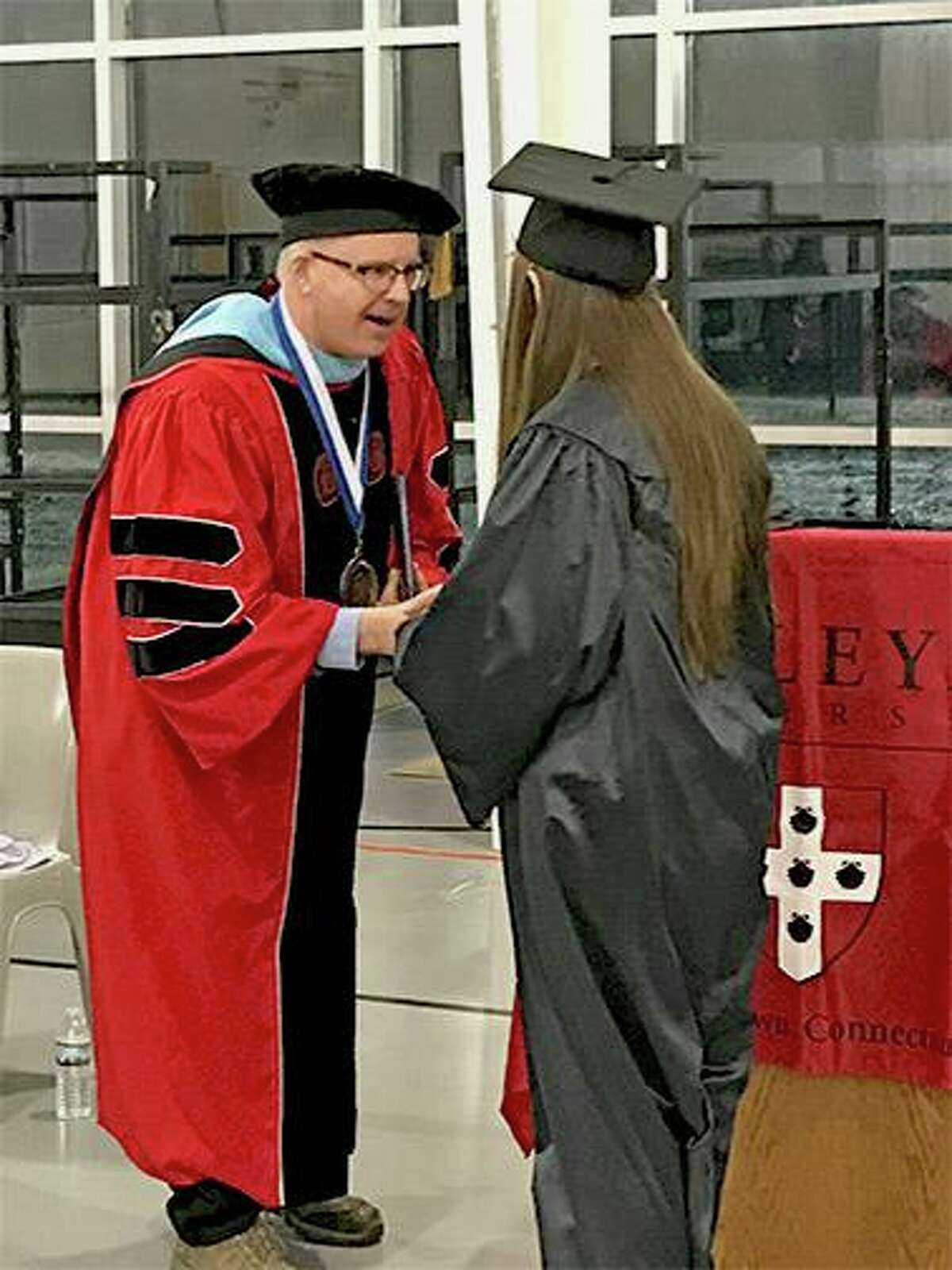 Tracy Shumaker, one of the seven women who received her associate’s degree through Wesleyan University’s Center for Prison Education, spoke during the recent graduation ceremony at York Correctional Institution in Niantic.