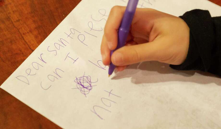savannah bedford, 7, writes a letter to santa at woodlands e