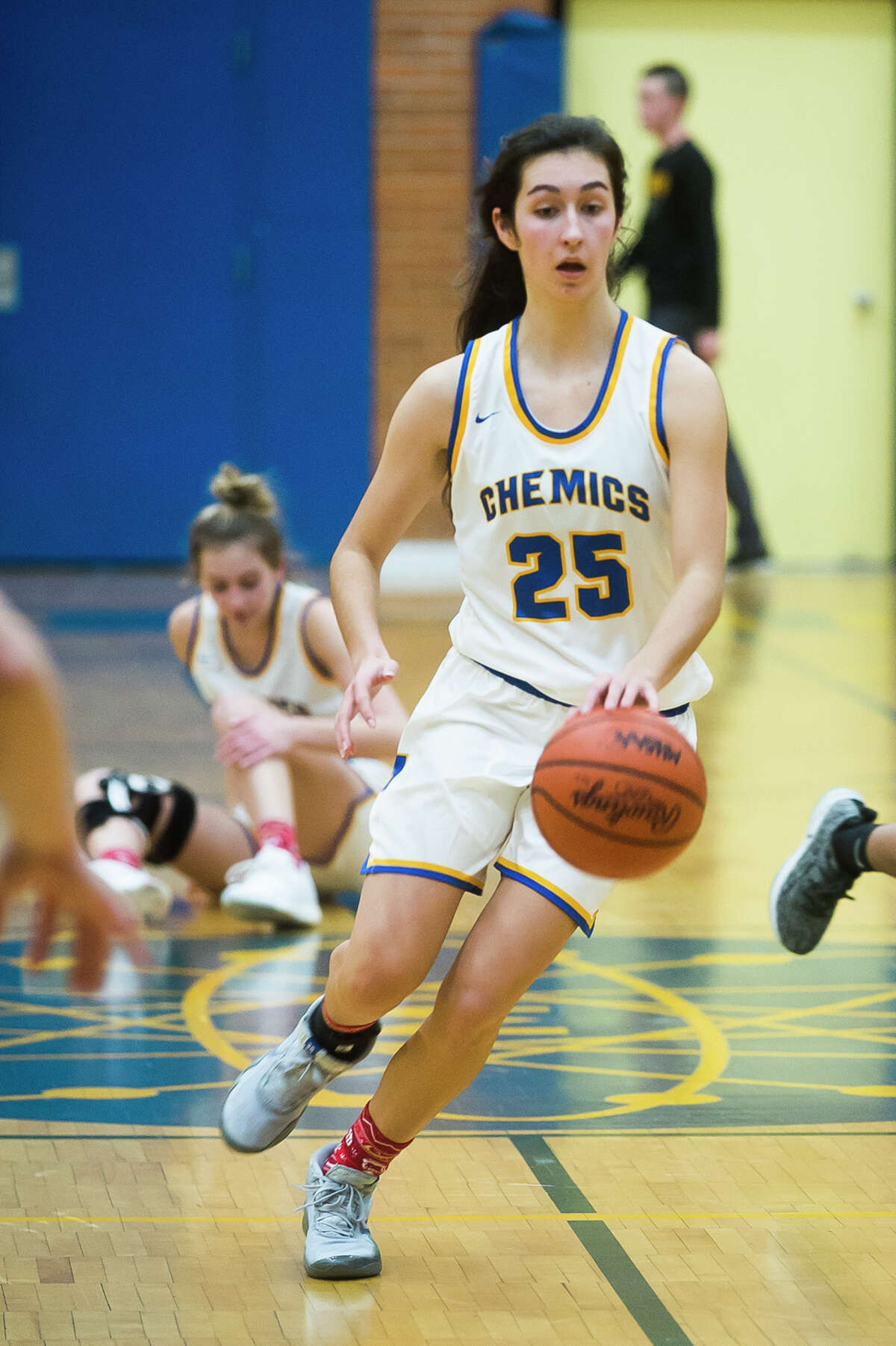 Midland's Sydnie Schafer dribbles down the court during the Chemics' game against Dow Thursday, Dec. 19, 2019 at Midland High School. (Katy Kildee/kkildee@mdn.net)