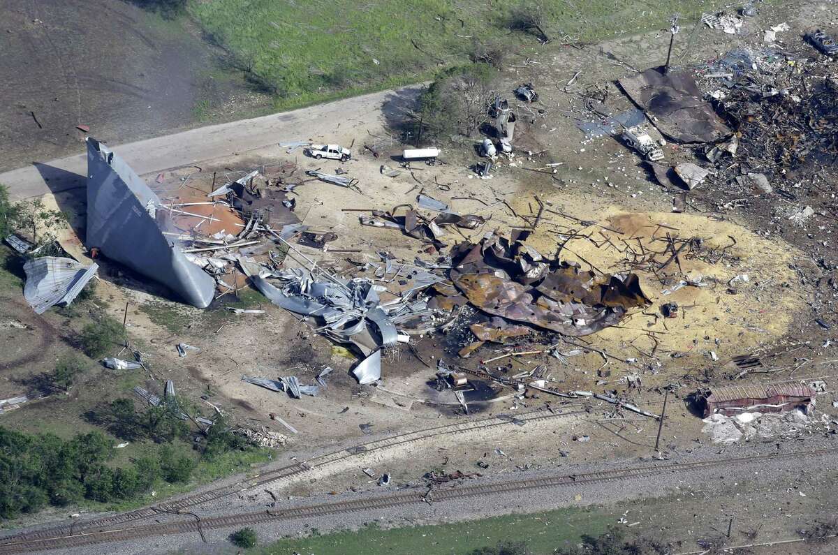 This aerial photo shows the remains of a fertilizer plant destroyed by an explosion in West, Texas, Thursday, April 18, 2013. A massive explosion at the West Fertilizer Co. killed as many as 15 people and injured more than 160, officials said overnight. The explosion that struck around 8 p.m. Wednesday, sent flames shooting into the night sky and rained burning embers and debris down on shocked and frightened residents. (AP Photo/Tony Gutierrez)