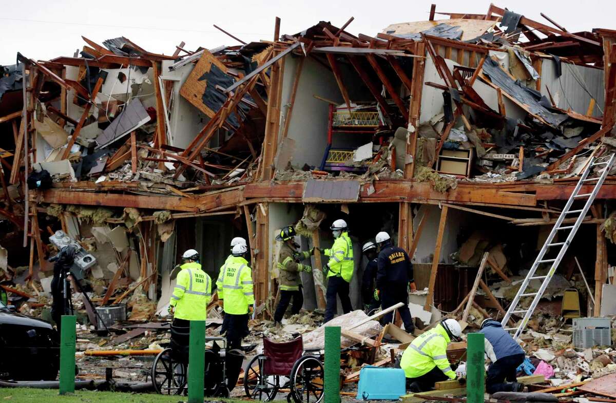 Firefighters conduct a search and rescue of an apartment destroyed by an explosion at a fertilizer plant in West, Texas, Thursday, April 18, 2013. A massive explosion at the West Fertilizer Co. killed as many as 15 people and injured more than 160, officials said overnight. (AP Photo/LM Otero)