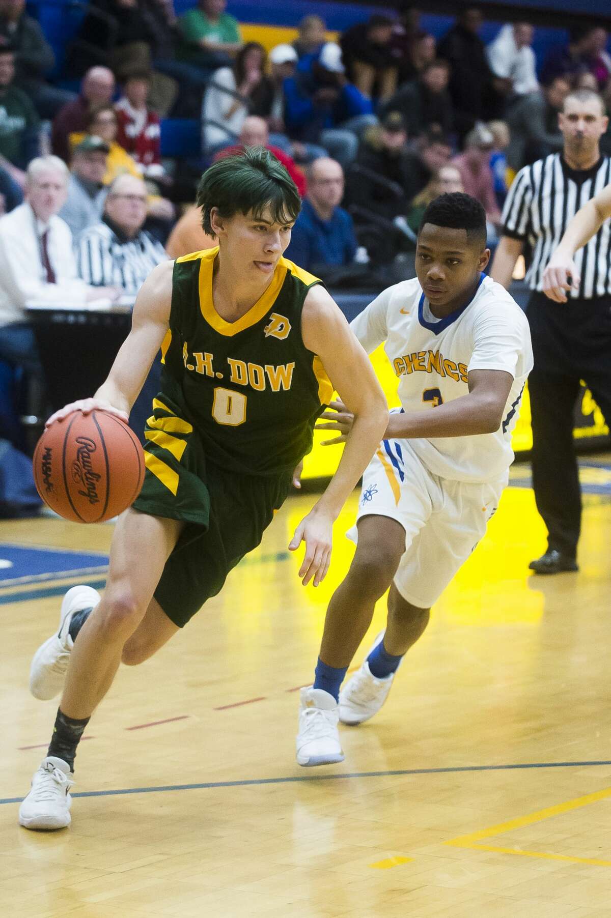 Dow's Drew Huber dribbles toward the basket during the Chargers' game against Midland Thursday, Dec. 19, 2019 at Midland High School. (Katy Kildee/kkildee@mdn.net)