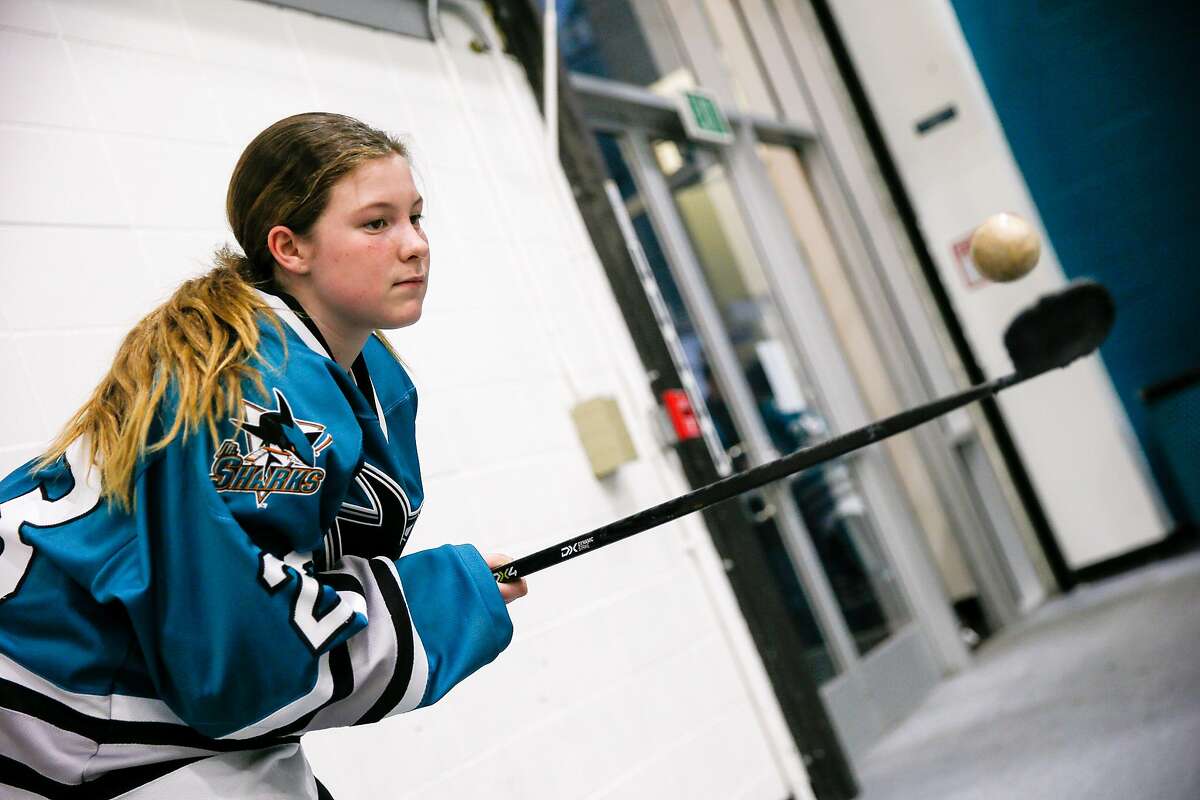 San Jose Jr. Sharks Keira Kippen-Mallais (23) of the Girls 14AAA team warms up and juggles a ball before the hockey game against the Stockton Colts at Solar4America Ice arena, Saturday, Dec. 7, 2019, in San Jose, Calif.