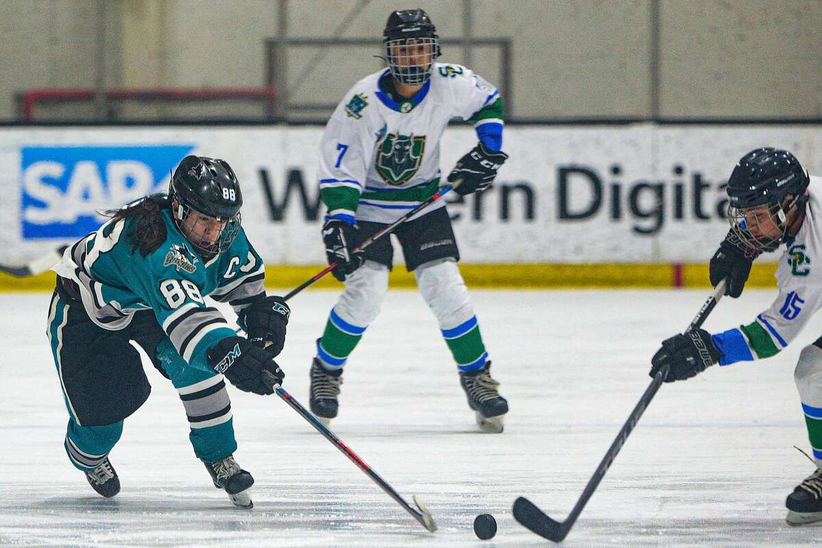 San Jose Jr. Sharks Natalie Fu (88) of the Girls 14AAA team battles for the puck against the Stockton Colts at Solar4America Ice arena, Saturday, Dec. 7, 2019, in San Jose, Calif.