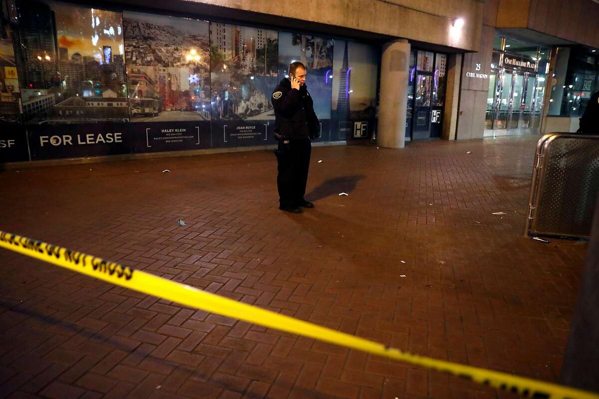 San Francisco Police investigate shots fired on Market Street near Powell Street BART station in San Francisco, Calif., on Thursday, December 19, 2019.