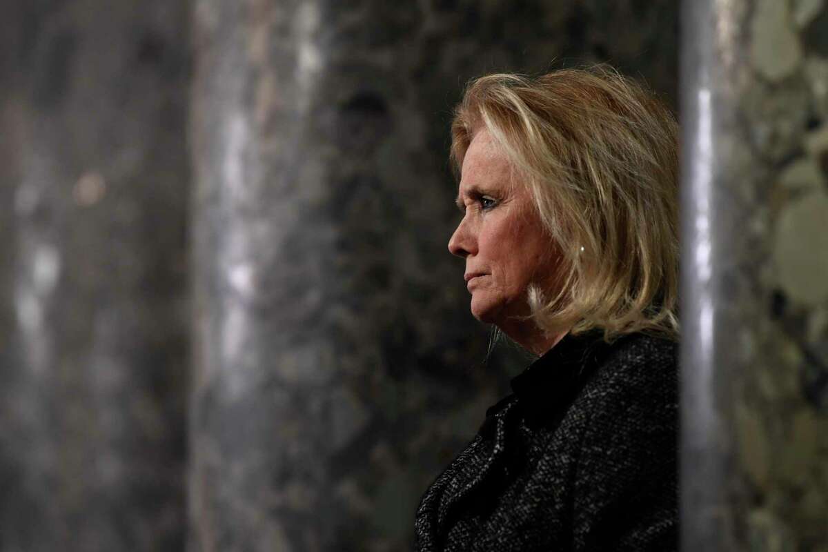 U.S. Rep. Debbie Dingell, D-Mich, speaks to reporters on Capitol Hill in Washington, Wednesday, Dec. 18, 2019.