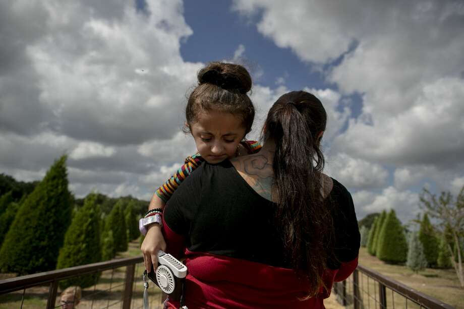 Sammi Haney, 9, is carried by her mom Priscilla Haney onto a wagon for a hay ride during a homeschool day outing at Devine Acres Farm in Devine, Texas, Oct. 2, 2019. Because of Sammi's osteogenesis imperfecta (OI), commonly known as Òbrittle bone disease,Ó she and her parents have to take precautions to keep Sammi safe while also trying to let Sammi be independent and do things able bodied kids can do. ÒPeople are all like ÔOh, I feel so sorry for them (people with disabilities).Õ They donÕt need to feel sorry- weÕre good. We can get around, we can eat by themselves. I can sit in a chair!Ó Sammi says. ÒNo one needs to feel sorry for me or anybody, itÕs the way we are.Ó Photo: Josie Norris/The San Antonio Express-News